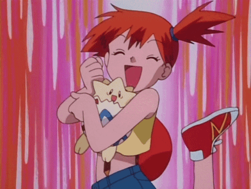 a girl with red hair is holding a stuffed animal with a star on it