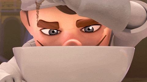 a close up of a cartoon character 's face looking out of a bowl