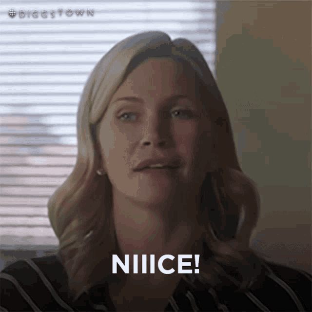 a close up of a woman 's face with the word niiiice written on it