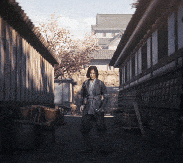 a man in a kimono is standing in a narrow alleyway