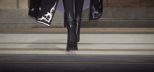 a person wearing black boots and a black coat is walking down stairs