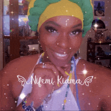a woman wearing a yellow and green turban with the name nifemi kiama written on the bottom right