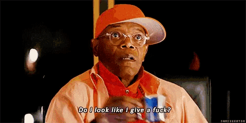 a man wearing an orange hat and glasses is holding a can of pepsi and says do i look like i give a fuck