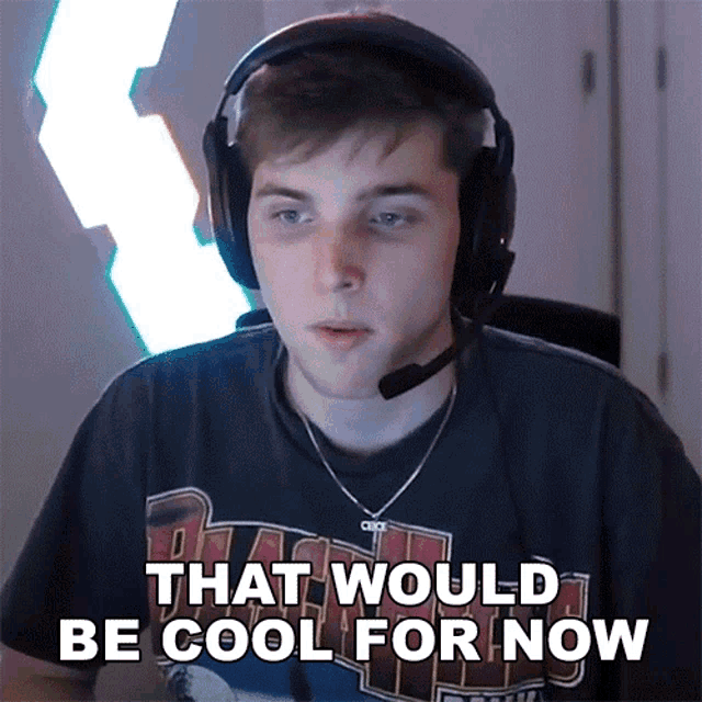 a man wearing headphones and a shirt that says ' that would be cool for now '