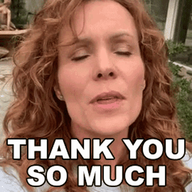 a woman with curly hair is saying thank you so much