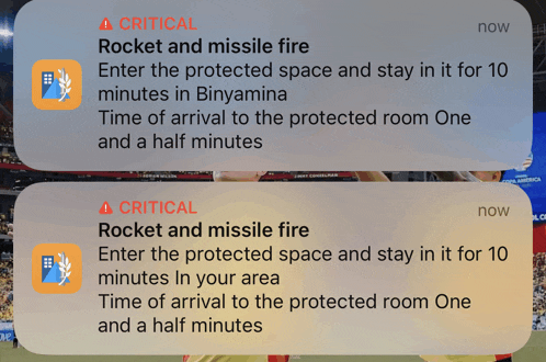 a critical rocket and missile fire notification is displayed on a phone screen