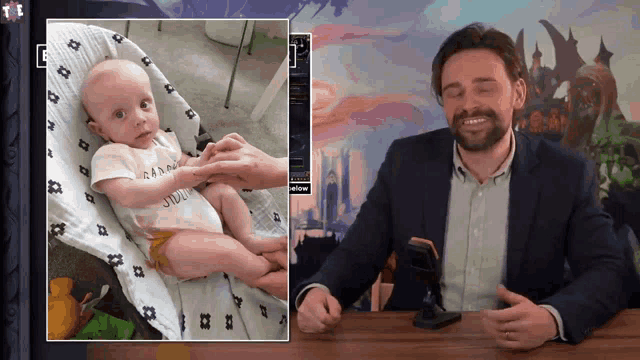 a man in a suit is sitting at a table with a picture of a baby in a high chair