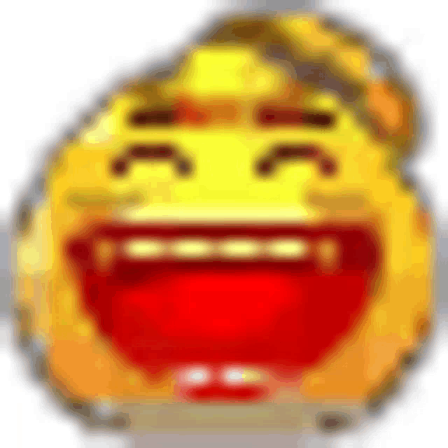 a yellow smiley face with a red mouth is laughing with a blurred background .