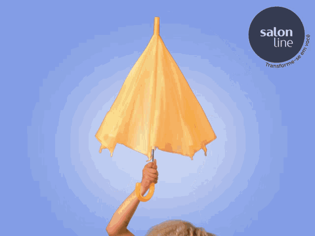 a woman is holding a yellow umbrella with a salon line logo in the background