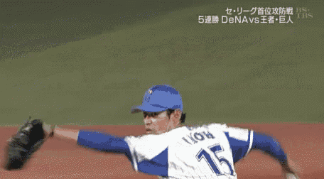 a baseball game is being played on a field with chinese writing on the fence