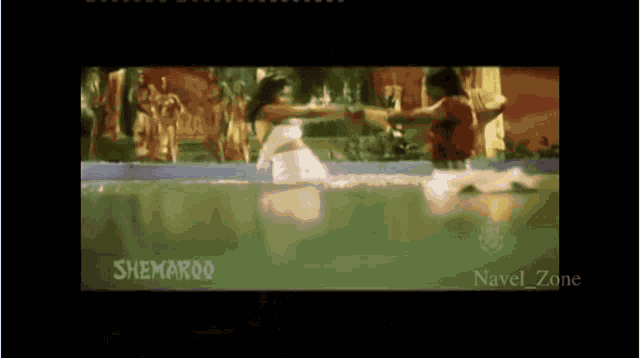 a man and a woman are dancing in a pool with the words sneha roo on the bottom