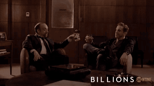 two men are toasting with whiskey in a showtime ad for billions
