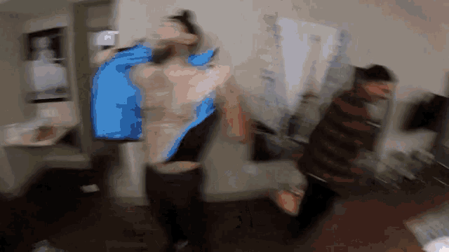 a blurry photo of a man with a blue jacket on