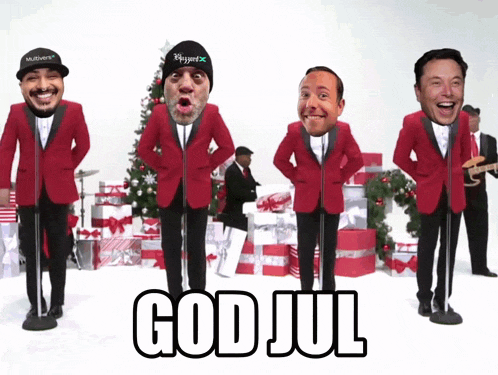a group of men in red suits singing god jul in front of a christmas tree