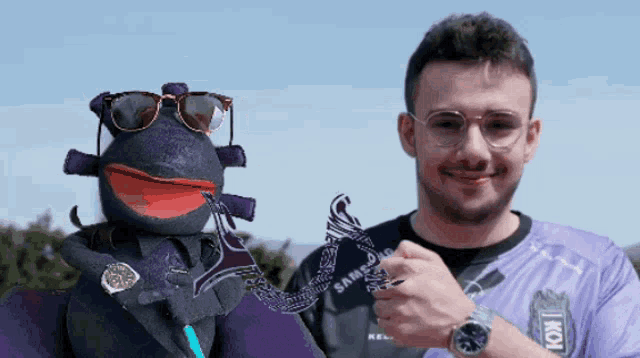 a man wearing a samsung shirt holds a trophy