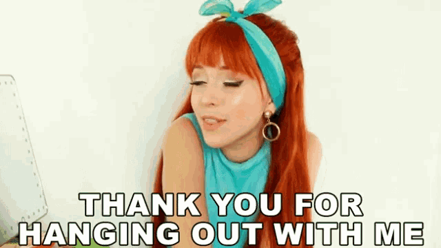 a woman with red hair and a blue headband says thank you for hanging out with me .