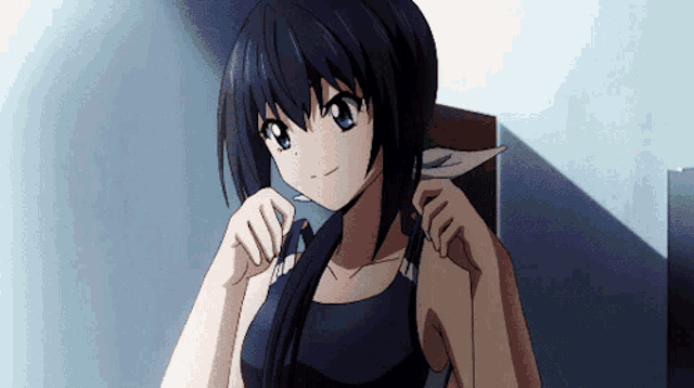 a girl with black hair and blue eyes is wearing a black tank top