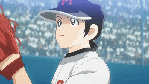 a baseball player with a letter m on his hat
