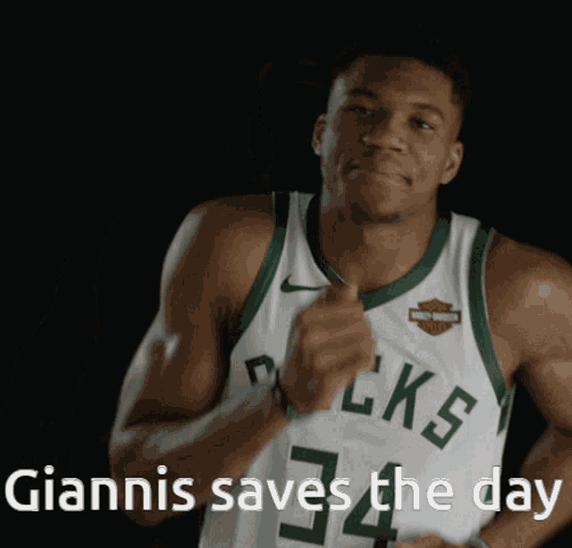 a basketball player with the number 34 on his jersey is smiling