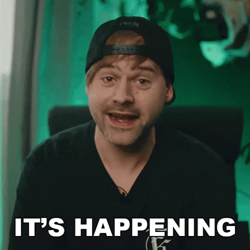 a man in a hat says it 's happening in front of a green background