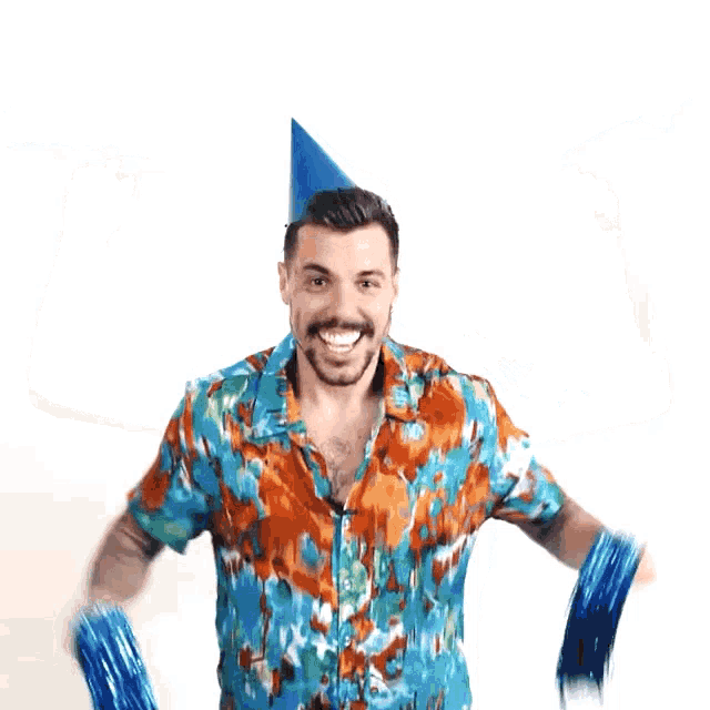 a man is wearing a party hat and holding blue feathers