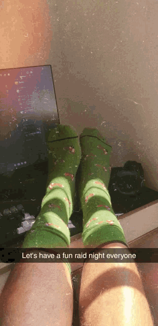 a person wearing green socks has a snapchat caption that says " let 's have a fun raid night everyone "