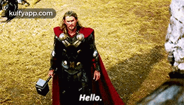 thor is holding a hammer in his hand and says `` hello '' .