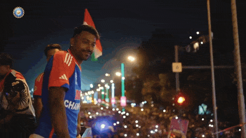 a man in a blue shirt with the word char on the front