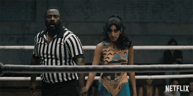 a man and a woman standing in a boxing ring with netflix written on the bottom