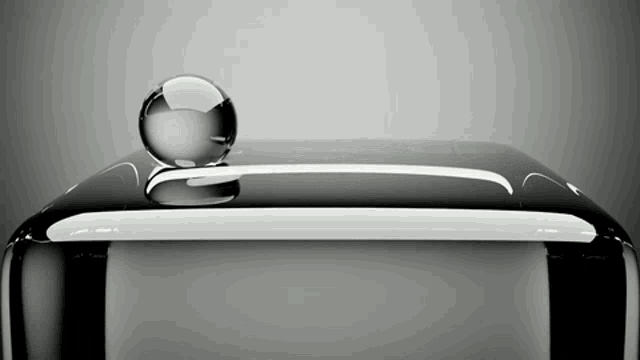 a black and white item with a glass ball on top