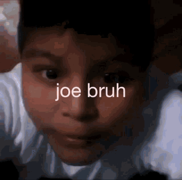 a close up of a child 's face with the words joe bruh written on the bottom