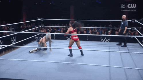 a wrestling ring with a sign that says cw