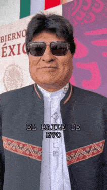 a man wearing sunglasses and a jacket says el baile de evo