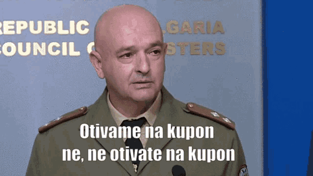 a man in a military uniform stands in front of a sign that says republic council on it