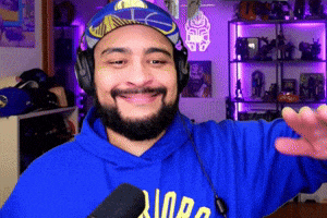 a man with a beard wearing a blue hoodie that says ' norg ' on it