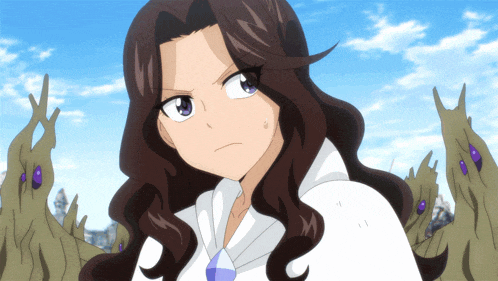 a girl with long brown hair and a white shirt looks angry