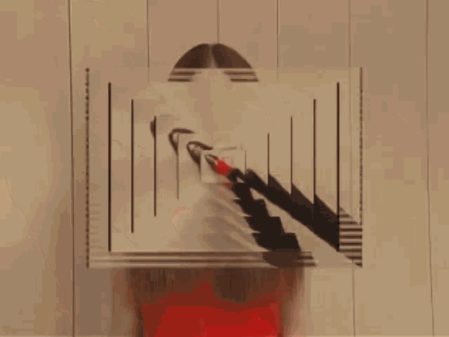a woman with long brown hair is wearing a red dress