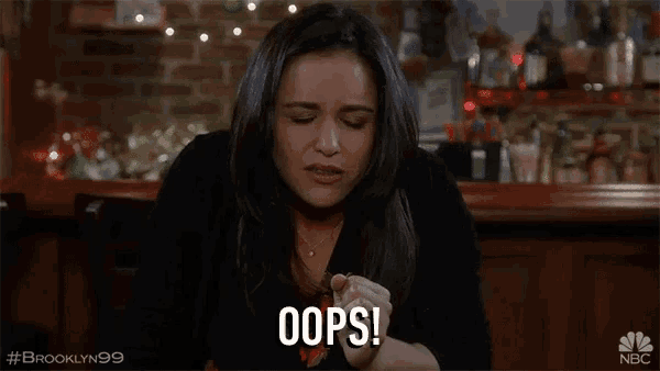 a woman is making a face and saying oops