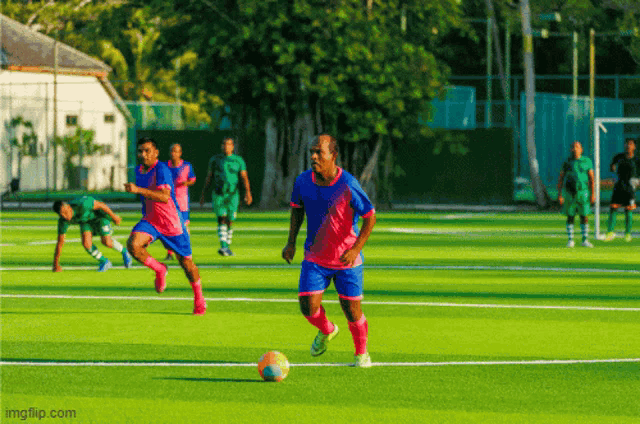 a group of soccer players are playing on a field with imgflip.com at the bottom of the screen