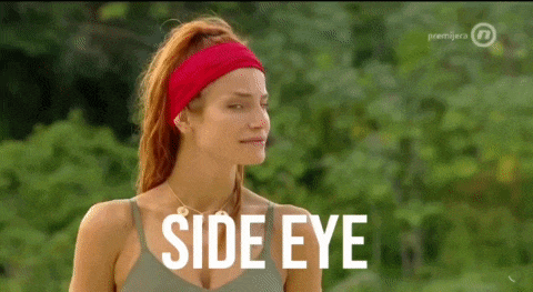 a woman wearing a red headband says side eye on a television screen