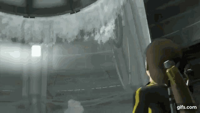 a woman in a yellow and black suit is standing in a room in a video game .