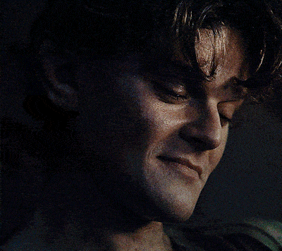 a close up of a man 's face with a serious look on his face