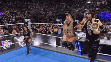 three women in a wrestling ring with the word netflix on the bottom right