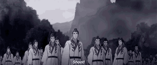 a group of men are standing in a line and one of them says shoot