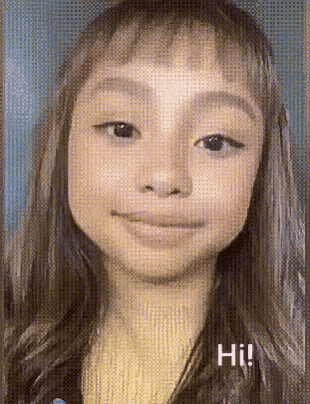 a close up of a young girl 's face with the words hi written on the bottom .