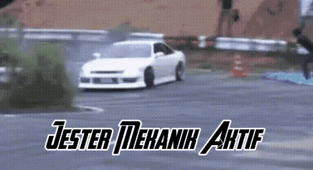 a white car is driving down a road with the words jester mekanik aktif written on it