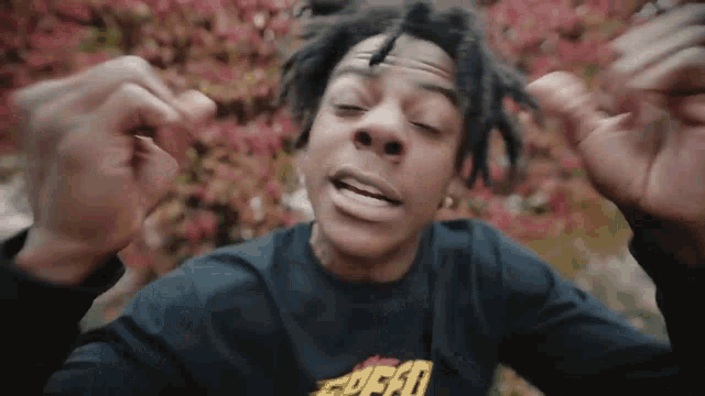 a young man with dreadlocks is wearing a black shirt that says ford