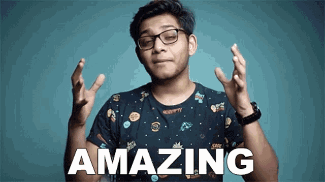 a man wearing glasses and a black shirt says amazing