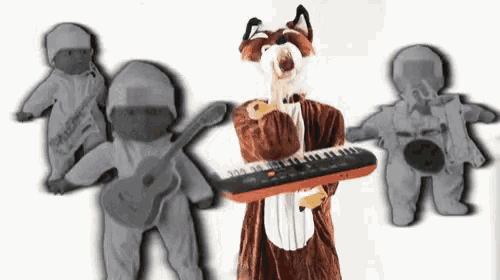 a fox mascot is holding a keyboard while two dolls are playing guitars