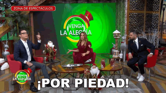 a group of people sitting in front of a green screen that says venga la alegria on it